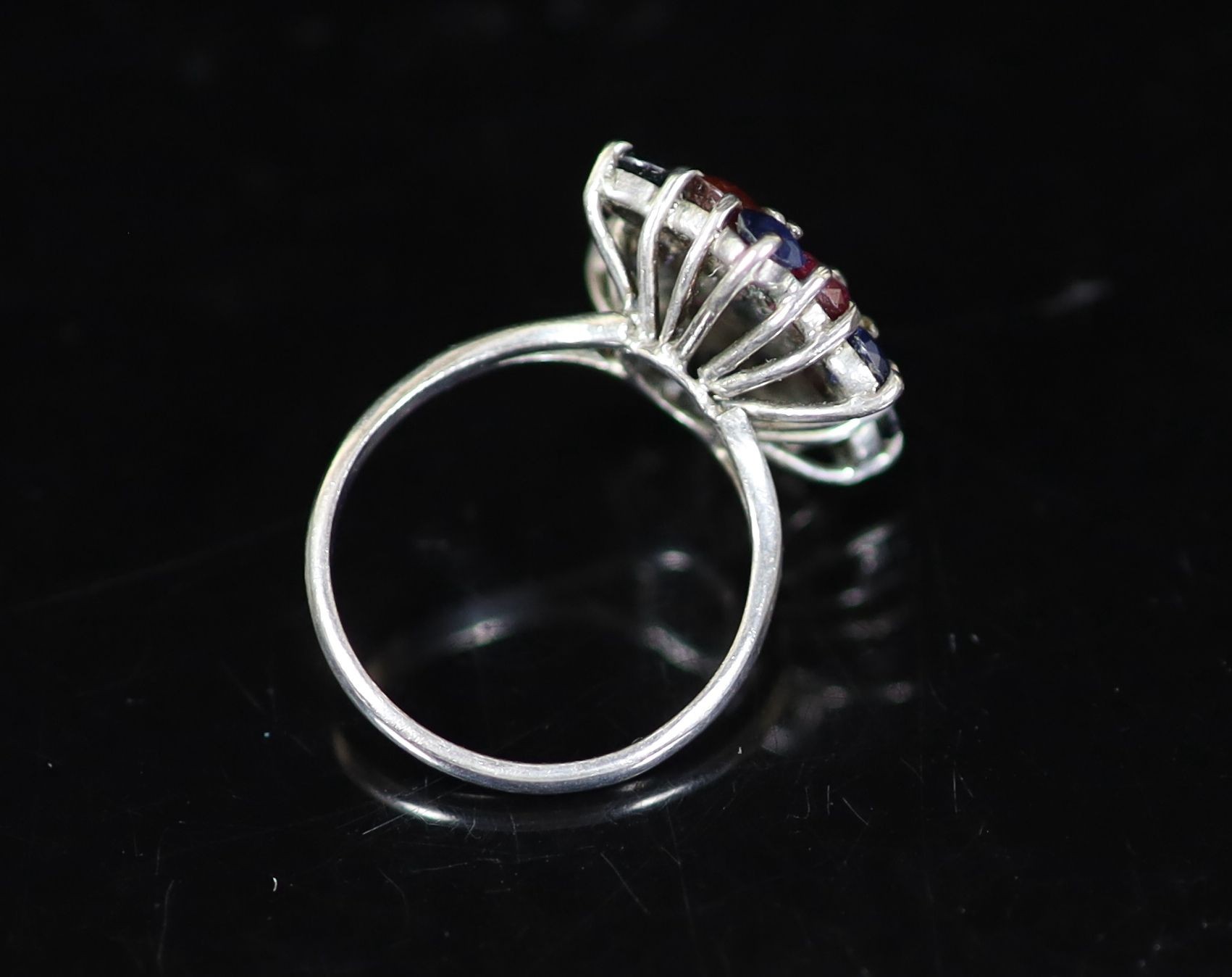 A mid 20th century platinum, ruby, sapphire diamond and amethyst cluster dress ring
